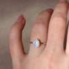 Blue flash moonstone floating oval wire wrapped ring gold filled on hand