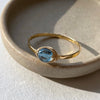 London blue topaz dainty wire wrapped bezel stacking ring gold filled close up