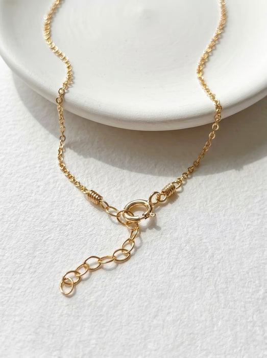 Dainty pearl and aquamarine two charm necklace solid 14k gold clasp detail view