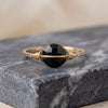 Gold filled wire wrapped black tourmaline bisected circle or half circle dainty band grounding crystal handmade ring close up