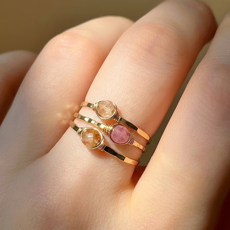 Dainty pink tourmaline stacking ring three piece set gold filled on hand