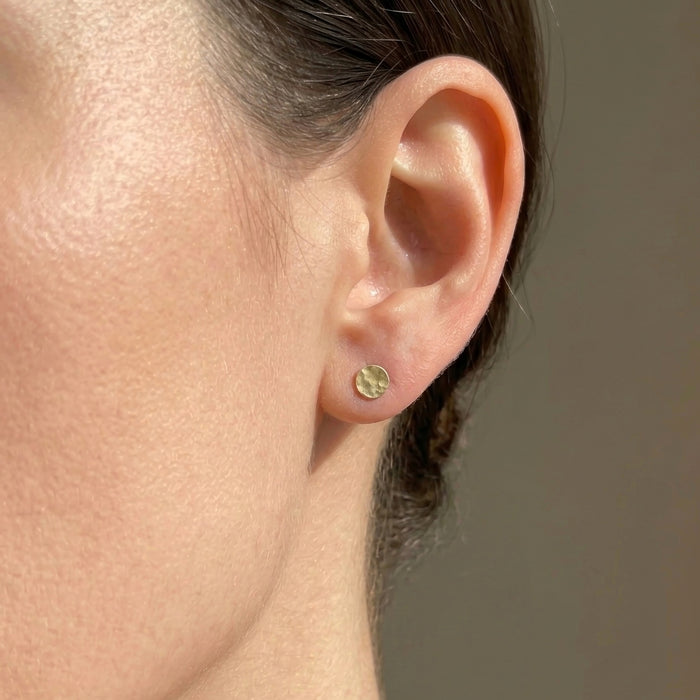 Hammered dot stud earrings 5mm small circle earrings gold filled on model
