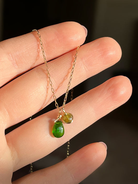 Gold filled wire wrapped dainty two tone asymmetrical green natural gemstone briolette necklace with chrome diopside and green tourmaline on hand