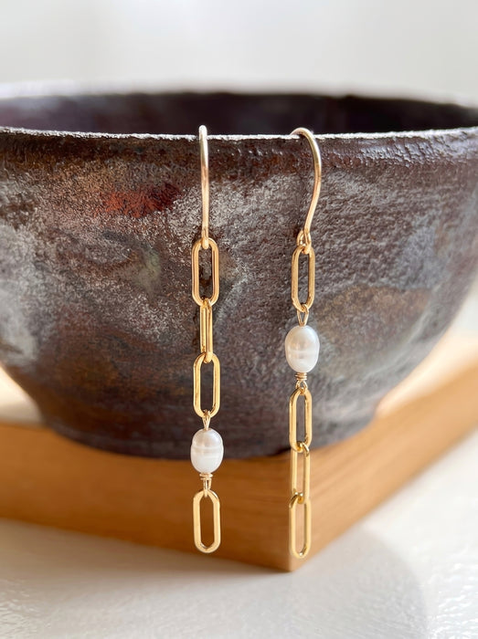 Paperclip chain and pearl mismatched drop earrings on model 14k gold filled vertical view