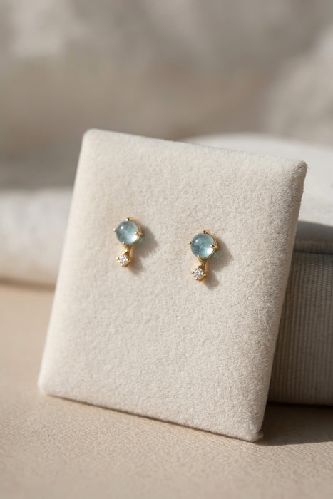 Aquamarine and topaz stud earrings gold vermeil on velvet display angle view