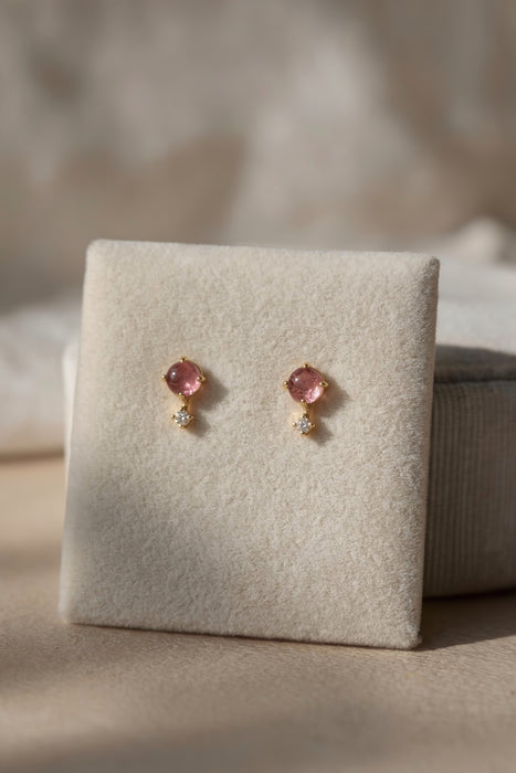Dainty pink tourmaline and topaz stud earrings gold vermeil on velvet display