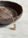 Dainty pearl charm pendant necklace solid 14k gold angle view