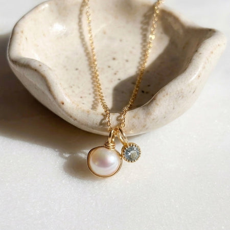 Dainty pearl and aquamarine two charm pendant necklace solid 14k gold close up