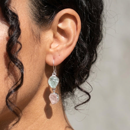 Raw rose quartz and aquamarine two stone drop earrings sterling silver on model
