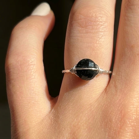 Black tourmaline saturn ring for empath protection sterling silver on hand