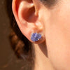 Raw tanzanite blue lavender statement stud earrings with raw natural crystals rough blue stone bold and colorful healing crystal stud earrings on model