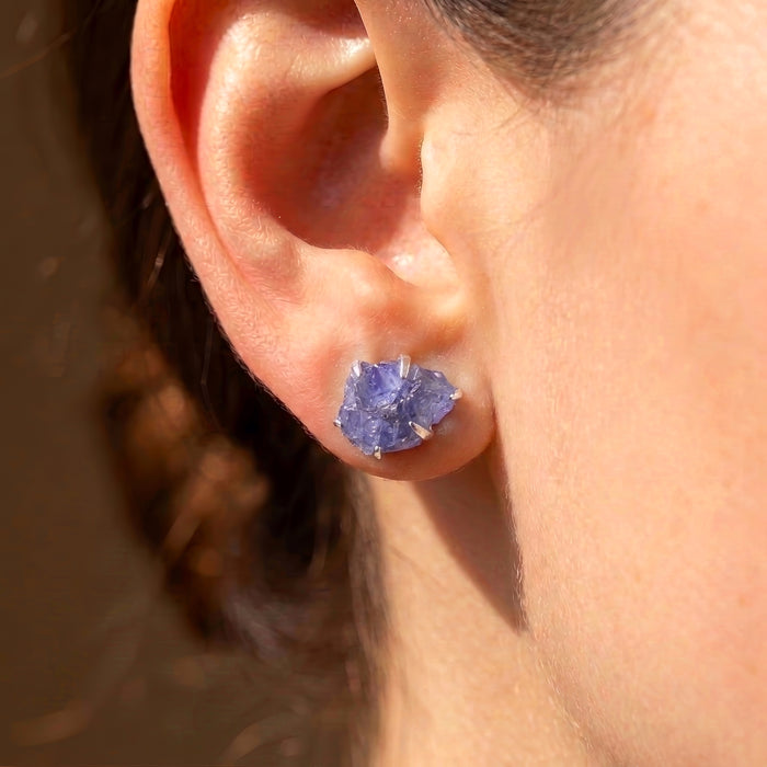 Raw tanzanite blue lavender statement stud earrings with raw natural crystals rough blue stone bold and colorful healing crystal stud earrings on model