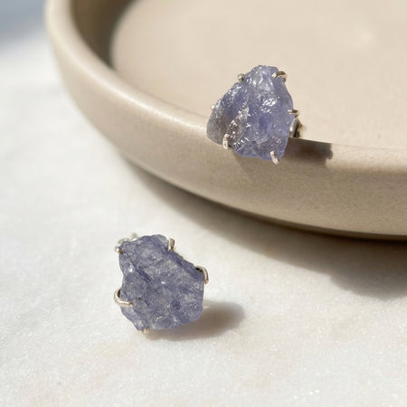 Raw tanzanite stud earrings sterling silver close up