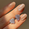 Raw tanzanite stud earrings sterling silver on hand
