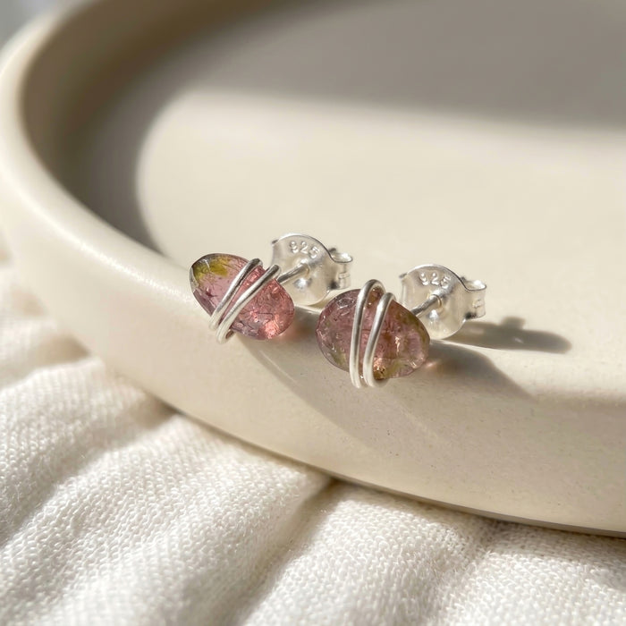 Watermelon tourmaline oval stud earrings on ceramic dish sterling silver
